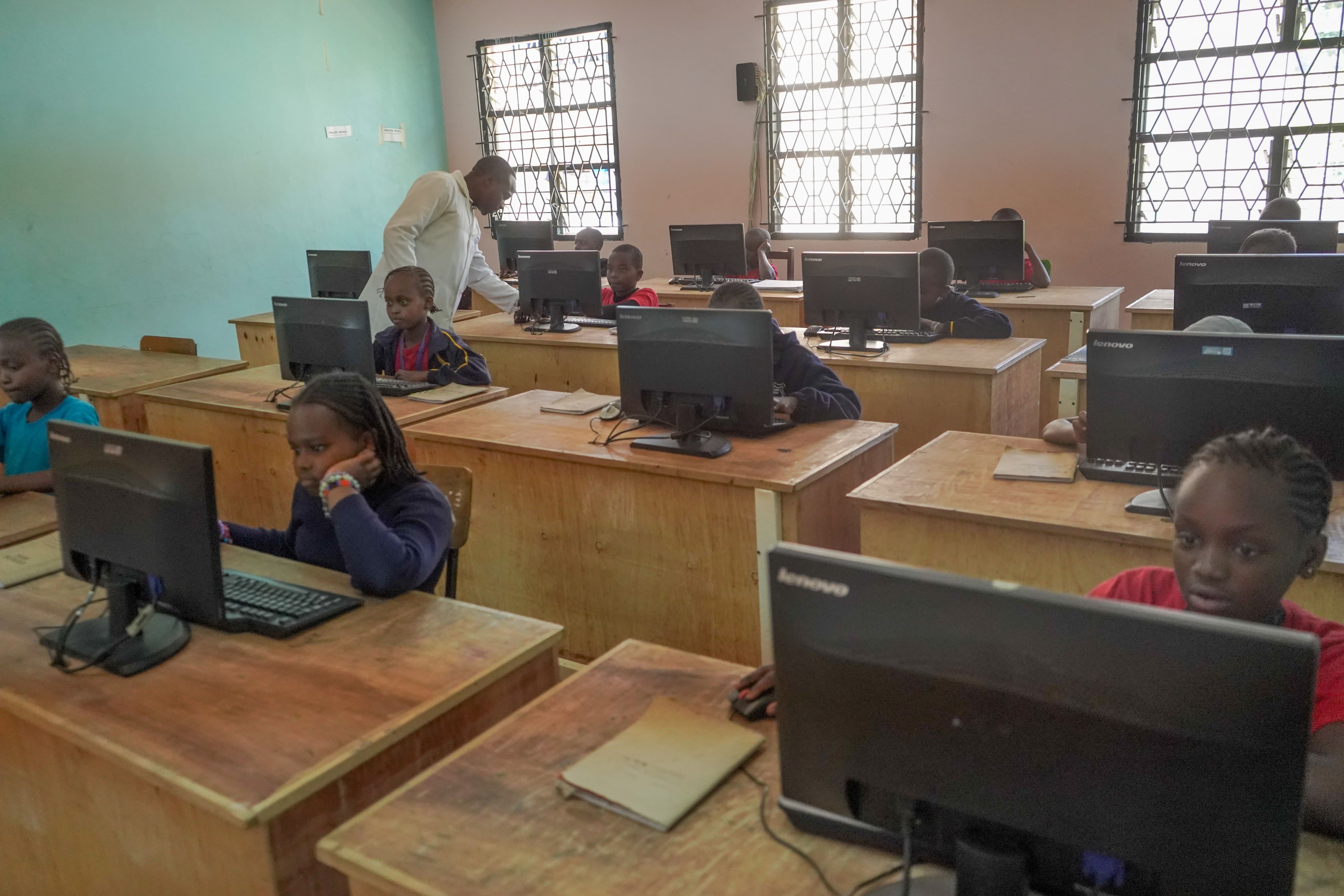 Havard School computer lab with students learning